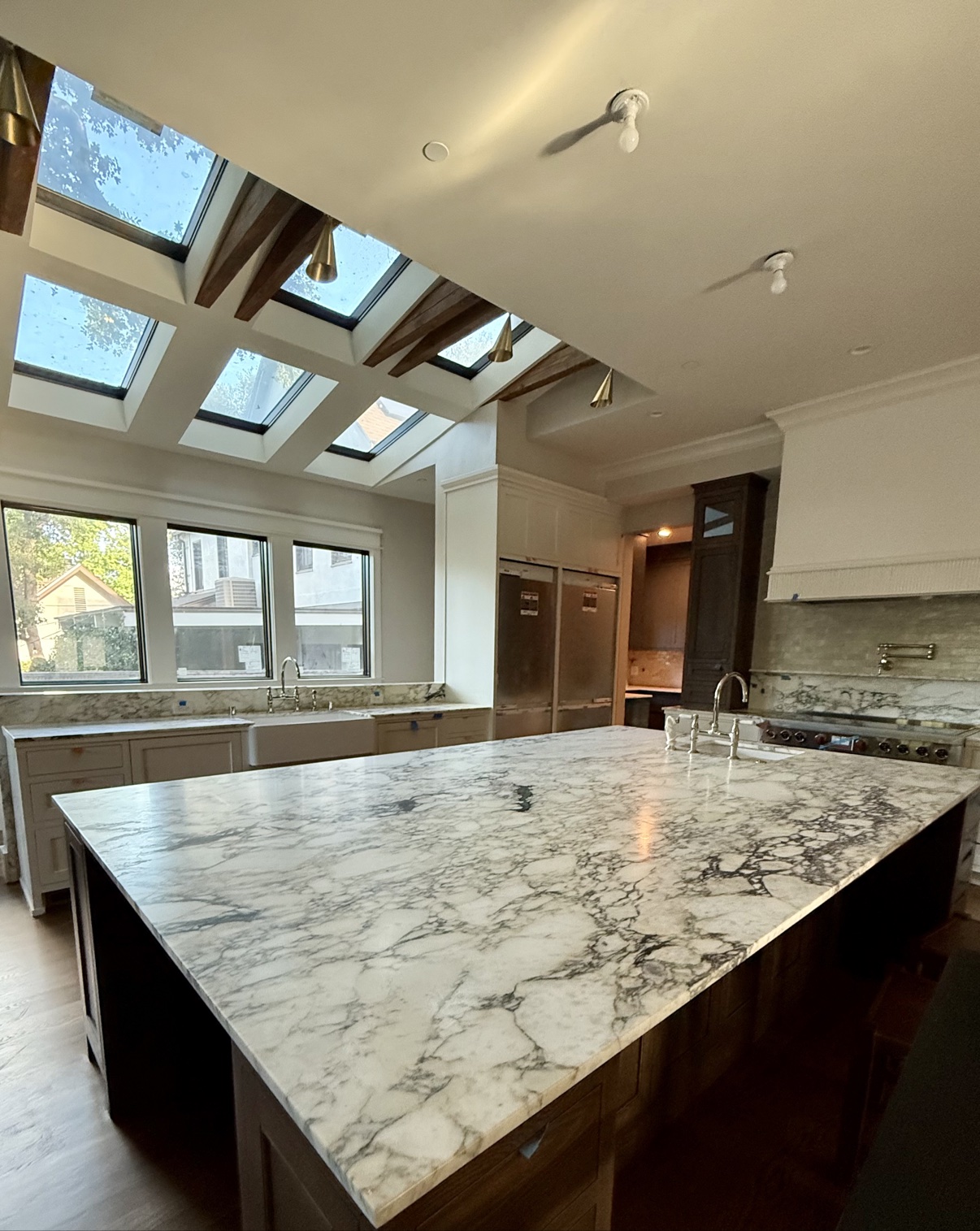 Kitchen remodel with skylights and marble island