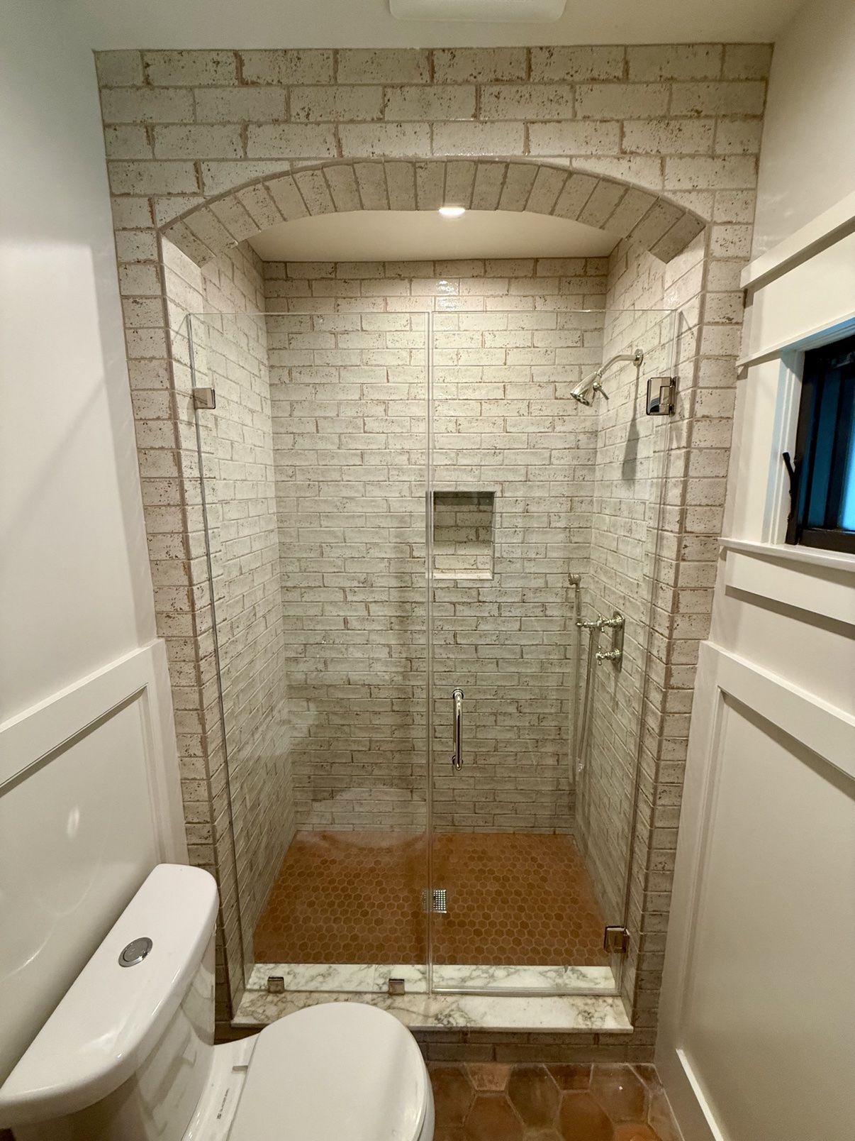 Shower with brick tile arch