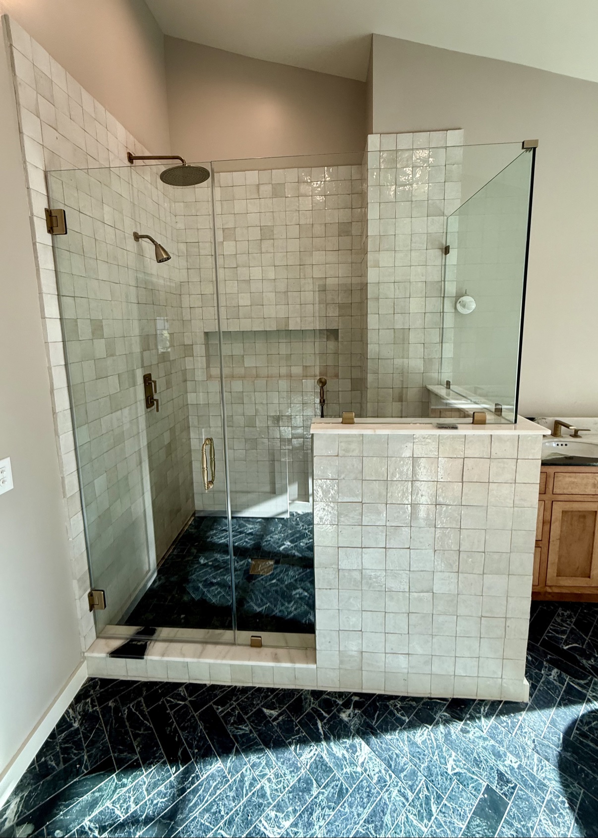 Shower with zellige tile and brass fixtures